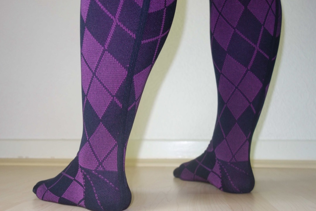 Flat-knit medical compression stockings laid out — the graduated garments at the center of compression therapy for venous insufficiency, edema, and lymphedema