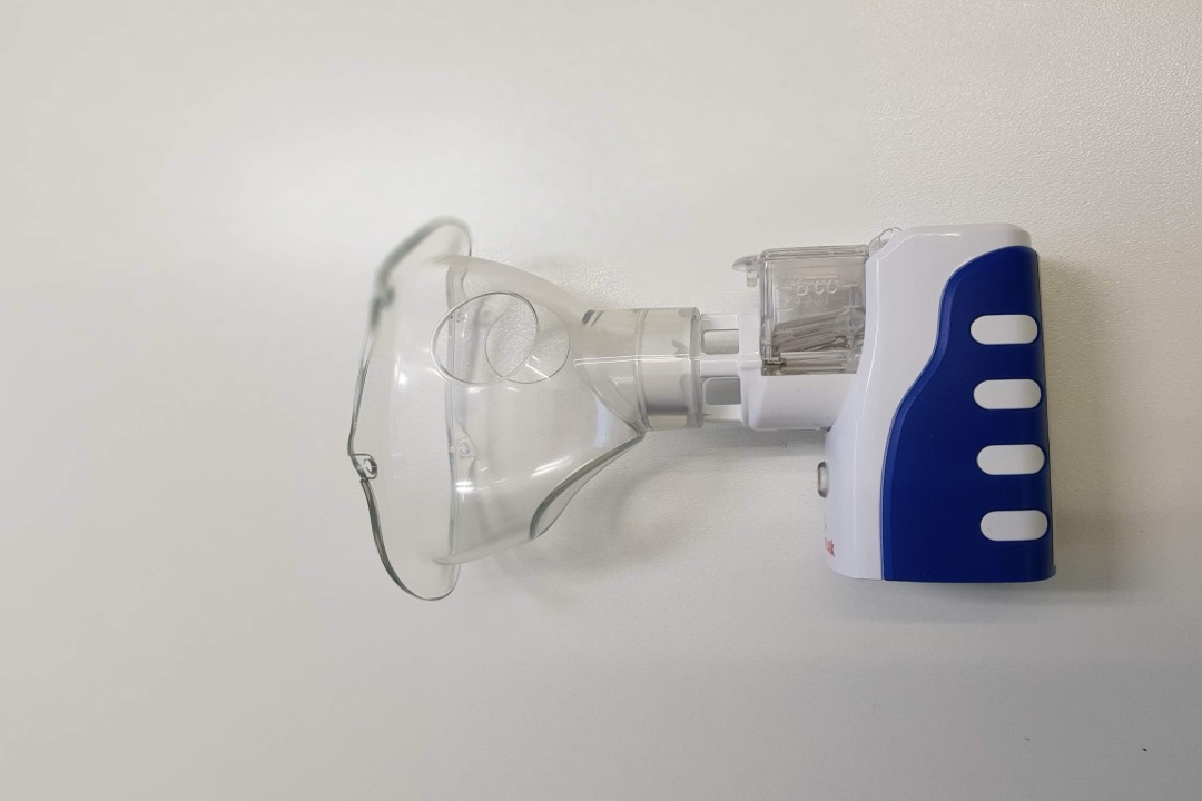 Patient using a nebulizer for asthma and COPD treatment