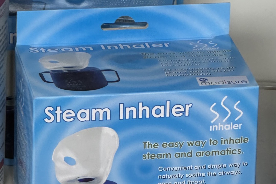 Personal steam inhaler displayed on a pharmacy shelf