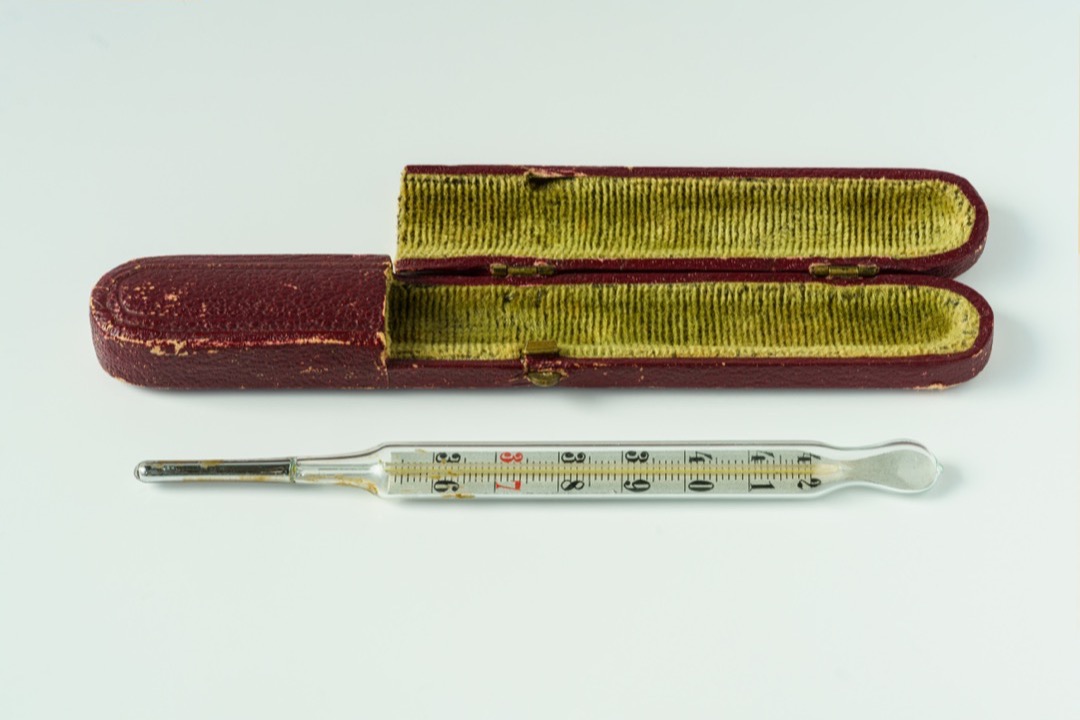 Medical mercury thermometer in velvet-lined cardboard box — digital vs mercury thermometer comparison