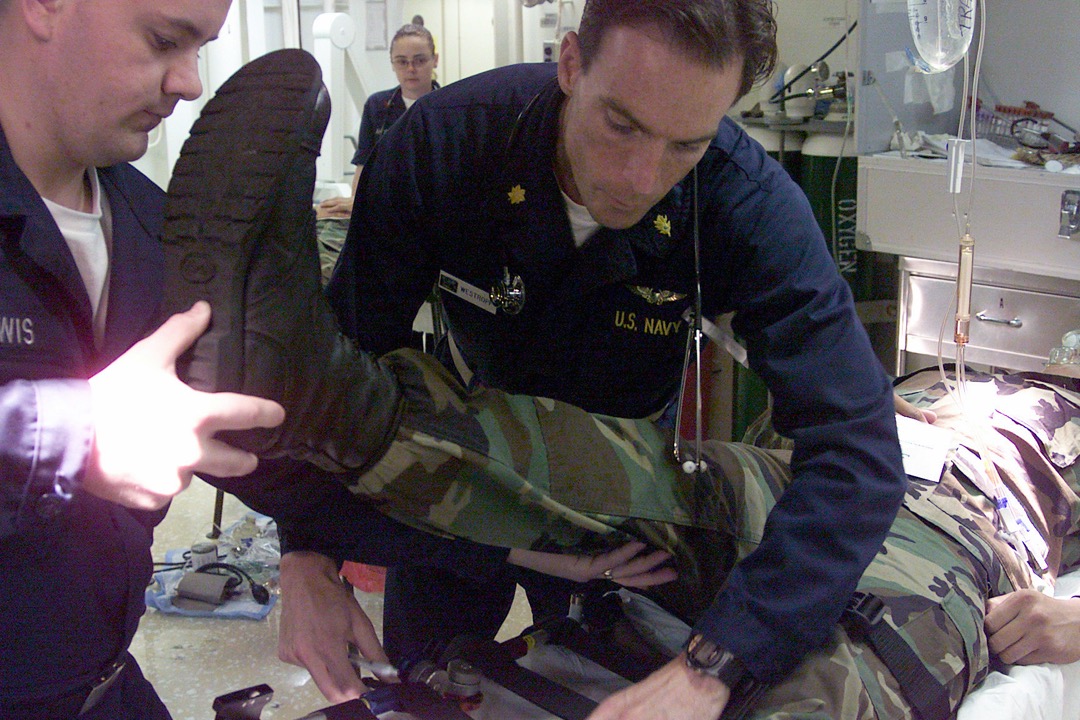 A clinician fitting a hinged knee brace on a patient's knee, illustrating how to choose the right brace by injury and condition